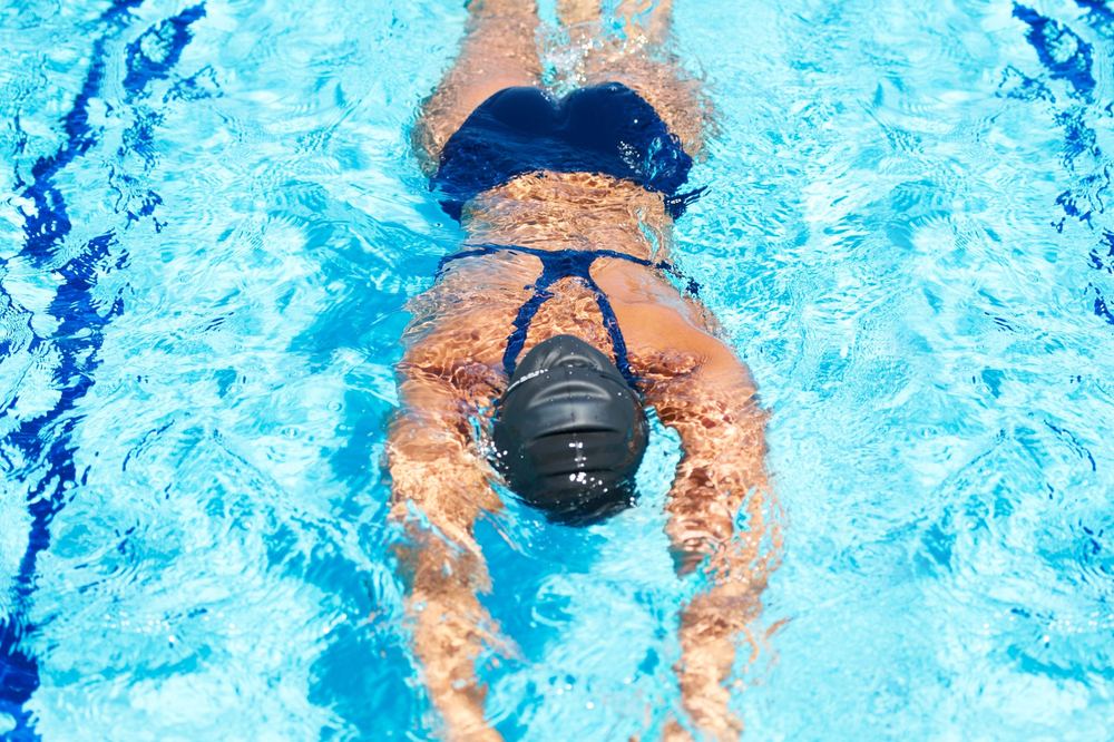 An adult swimmer working on stroke technique
