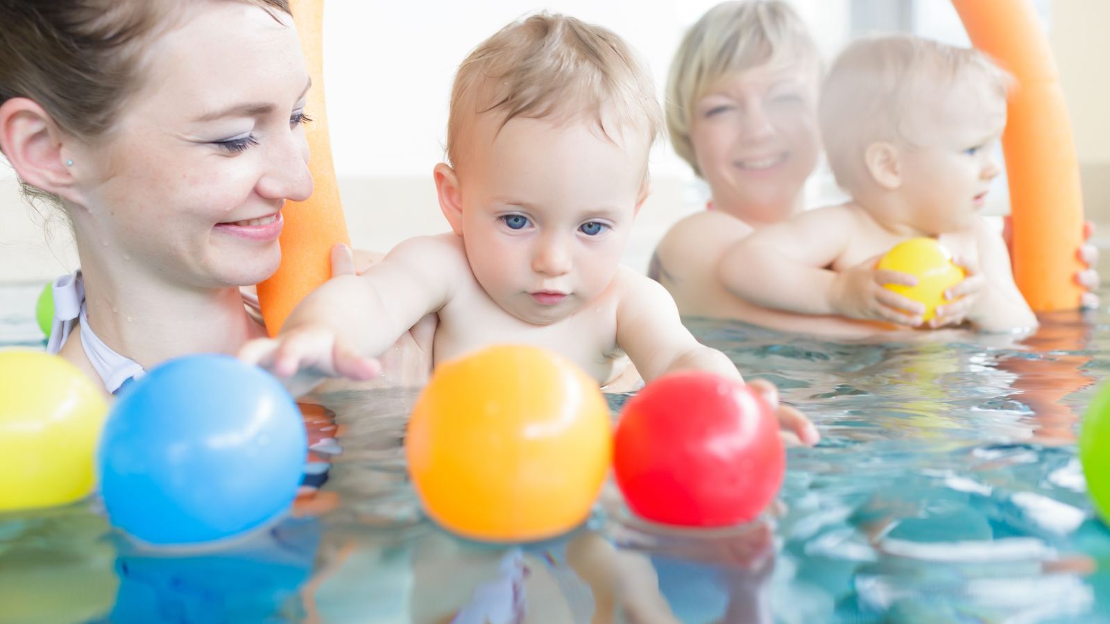 Child enjoying a swimming lesson at Swimmable