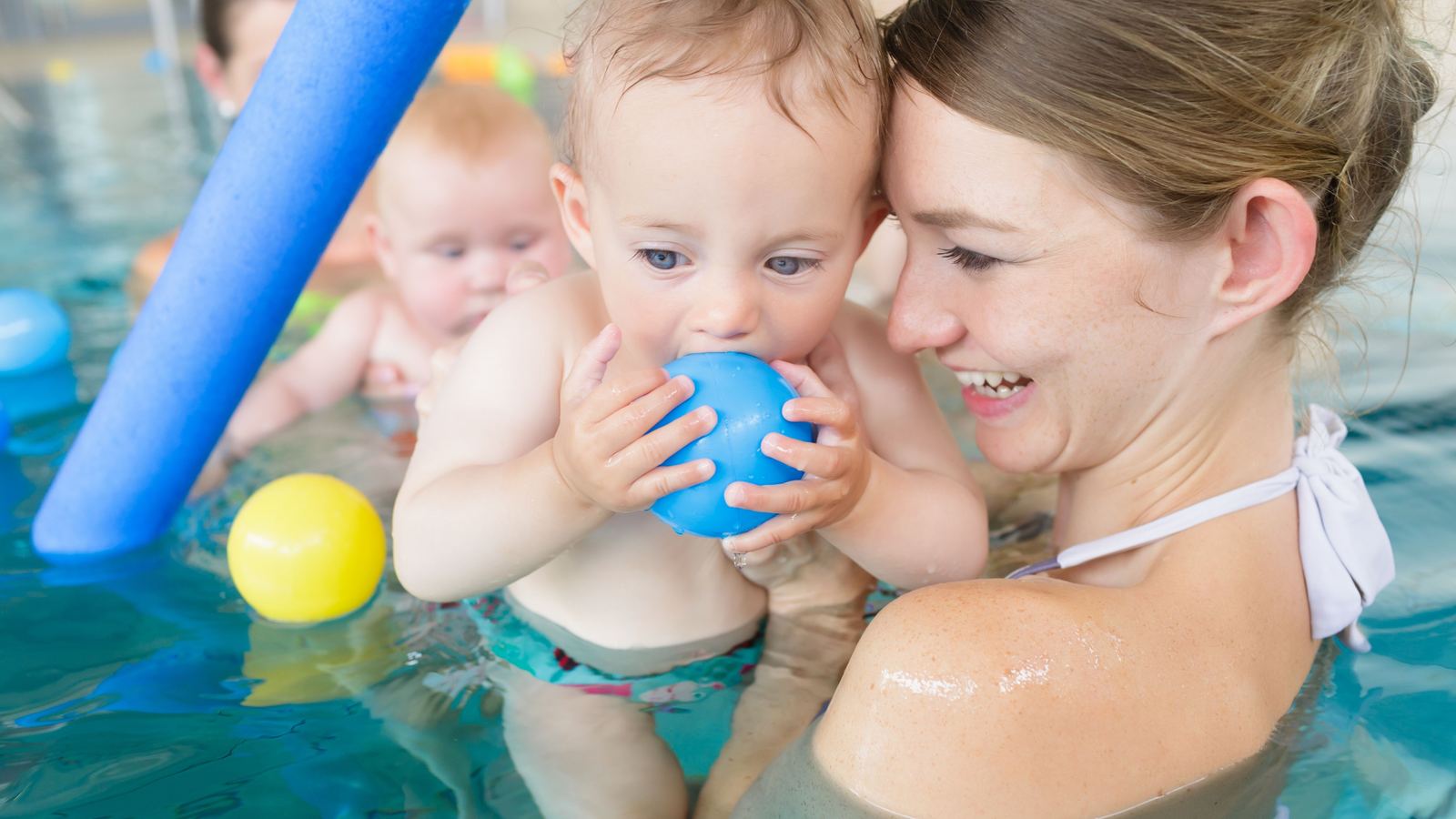 A parent and baby playing in the Swimmable pool